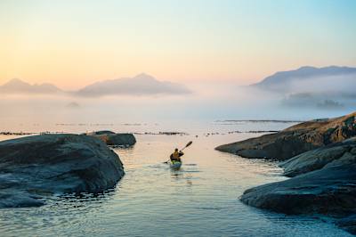 Tony Hoare sea kayaking off Vancouver Island, Canada in a photograph shot by Michael Clark.