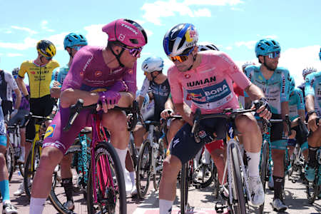 Primož Roglič of Red Bull-Bora-Hansgrohe in the pink leader's jersey alongside Mads Pedersen during Stage 8 of the Giro d’Italia 2025 from Giulianova to Castelraimondo, Italy