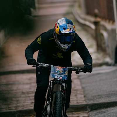Tomáš Slavík rides with intensity at the Red Bull Cerro Abajo event in Genova, Italy, near Teatro Nazionale Genova on August 24th, 2025, showcasing thrilling downhill mountain biking action