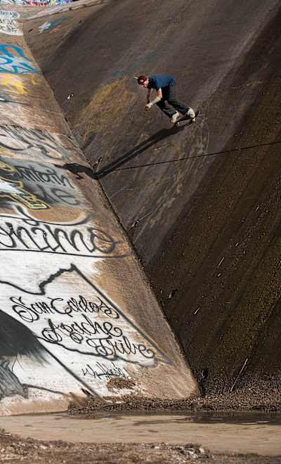 Madars Apse clings to the side of a dam in Arizona during filming for Season 2 of Skate Tales.