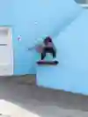 A skater does a trick in a street in San Francisco