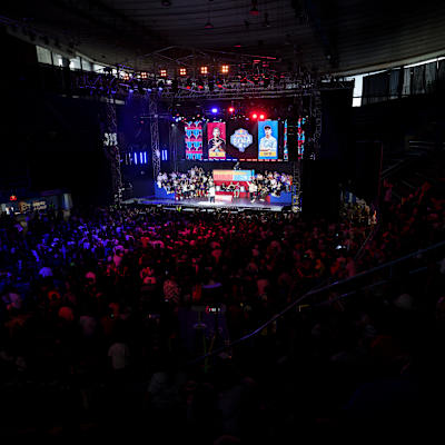 In 2024, the Red Bull Batalla National Final venue in Mexico City featured a large stage with vibrant screens and a packed crowd