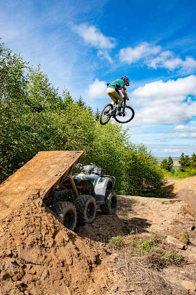 Laurie Greenland riding the Vanta line's boner quad jump at Bike Park Wales