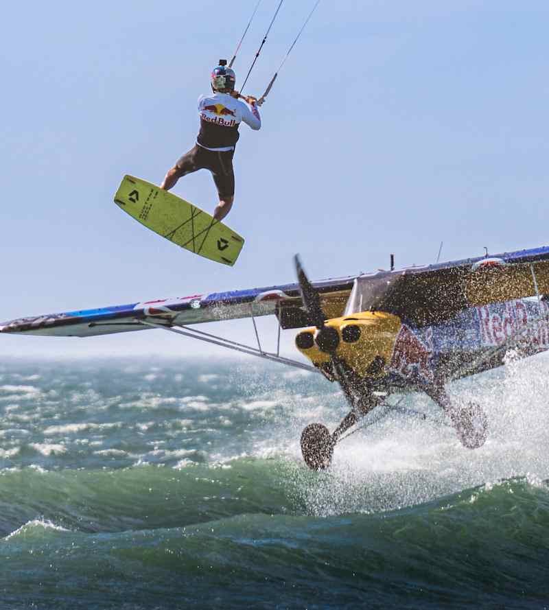 Epic world first Kitesurfer jumps over a flying plane
