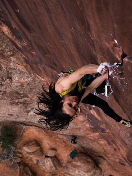 Krystle Wright photographs a climber making an ascent from above.