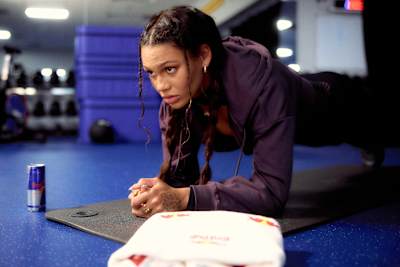 Trinity Rodman performs a forearm plank during a strength training session.