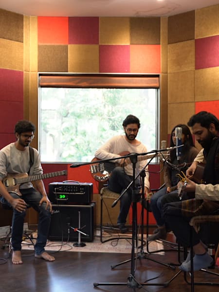 Musicians perform in the recording booth of Compass Box Studio in Ahmedabad.