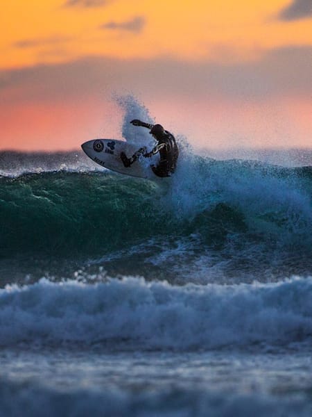 Surfing at sunset is stunning