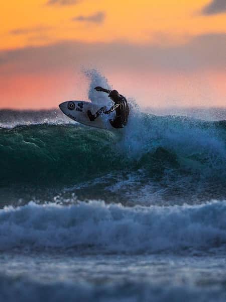 Surfing at sunset is stunning