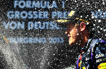 Sebastian Vettel celebrates on the podium after winning the German Grand Prix at the Nuerburgring on July 7, 2013 in Nuerburg, Germany. 
