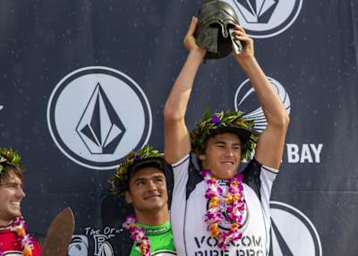 Jack Robinson on stage with the winners trophy at the 2019 Volcom Pipe Pro. 