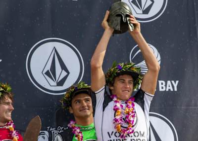 Jack Robinson on stage with the winners trophy at the 2019 Volcom Pipe Pro. 