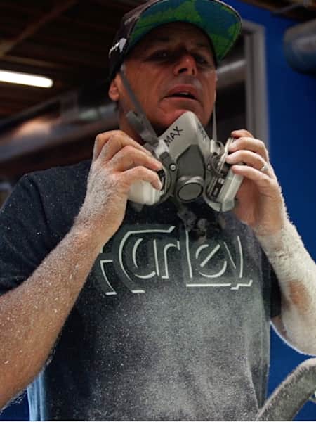 Hurley founder and subject of the latest Ripple Effect film from Red Bull Media House shapes a surfboard.