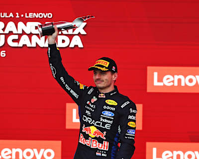 Max Verstappen lifts his trophy on the podium after the F1 Grand Prix of Canada in May 2026 in Montreal, Quebec.