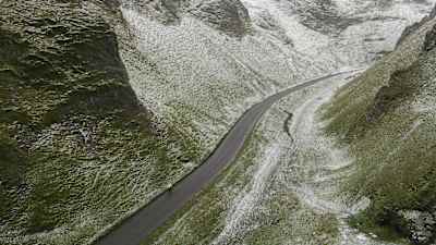 A cyclist descends a mountain pass in the Hope Valley in the United Kingdom