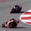 Pol Espargaro powers his Red Bull KTM Tech3 bike through a high-speed turn at the 2025 MotoGP Portuguese Grand Prix in Portimão, showcasing pure racing adrenaline