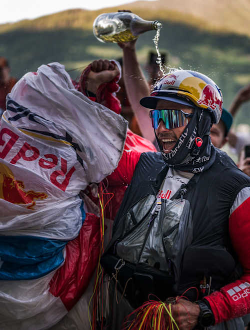 Aaron Durogati celebrating in Zell am See during Red Bull X-Alps 2025 on June, 22.