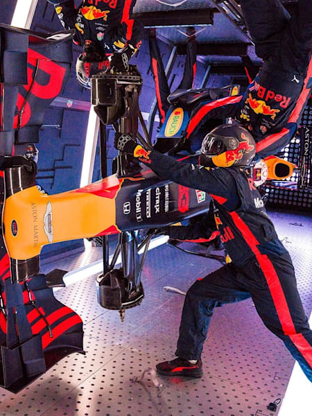 A photo of Aston Martin Red Bull Racing’s mechanics pictured performing the Zero-G pitstop aboard an aircraft in Russia.