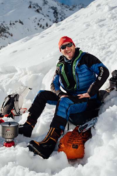Mountaineer Janusz Gołąb sitting in the snow on the way to Nanga Parbat's summit