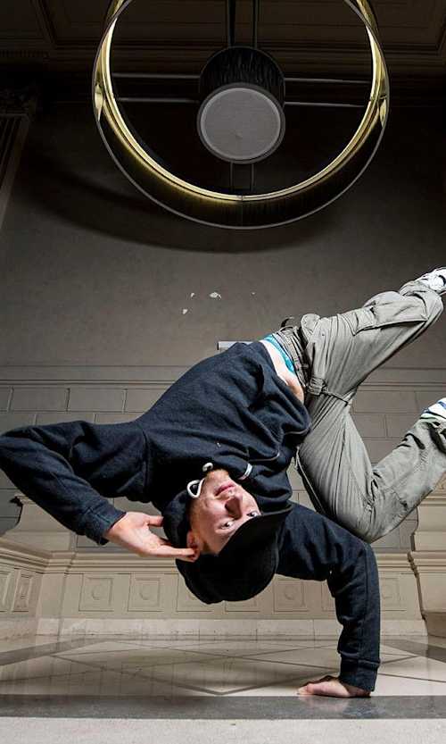 B-Boy Menno dances on a staircase.