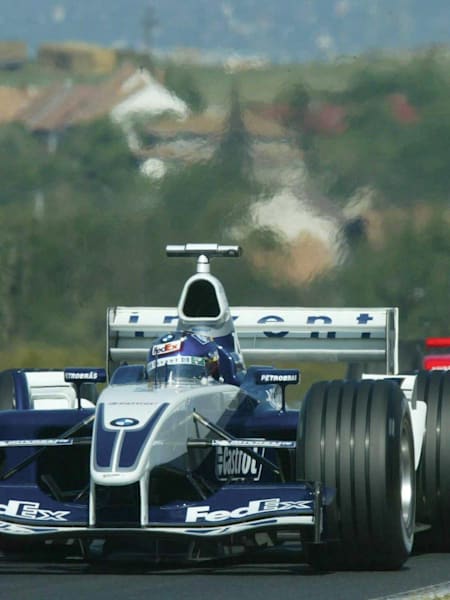 Juan Pablo Montoya's Williams leads the Ferrari of Michael Schumacher at the 2003 Hungarian Grand Prix. 