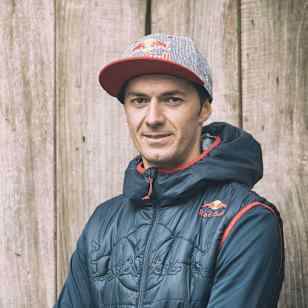 An image of Tiago Ferreira MTB rider in Red Bull hat and coat.