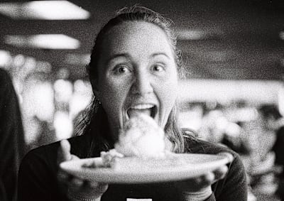A back and white still image of surfer Carissa Moore from the film RISS.