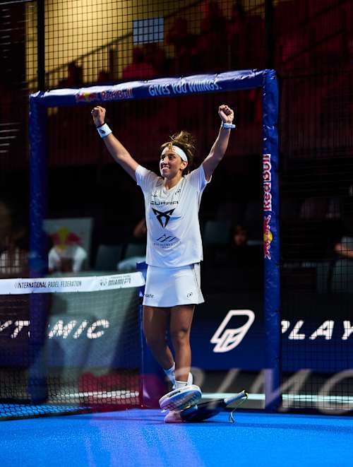 Beatriz González and Claudia Fernandez Sanchez rejoice on court during the 2026 Miami Premier Padel P1 semi-finals in the United States, surrounded by vibrant Red Bull branding