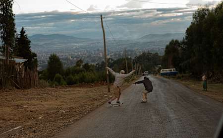 Skaters skating downhill.