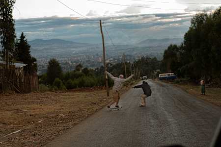 Skaters skating downhill.