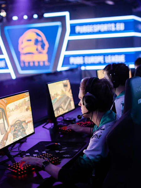 Professional players competing in PUBG at the official European league, PEL
