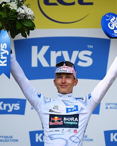 Florian Lipowitz of Team Red Bull - BORA - hansgrohe celebrates on the podium as White best Young Rider Jersey winner during the 112th Tour de France 2025, Stage 15.
