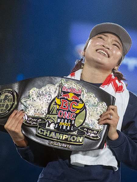 B-Girl Ami of Japan celebrates with the winners belt during the Red Bull BC One World Final at Court Philippe-Chatrier, Roland Garros, Paris, France on October 21, 2023.   