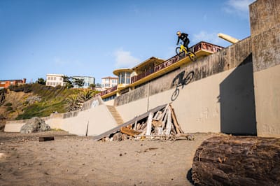 "If I dropped my front wheel, I was looking at going over the bars," says Macaskill of the China beach drop.