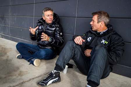 Extreme E CEO Alejandro Agag talks with Sébastien Loeb.
