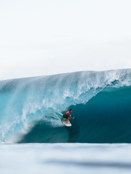 Italo Ferreira rides a big wave at the SHISEIDO Tahiti Pro 2024 in Teahupo'o, Tahiti.