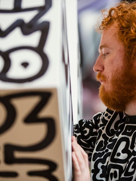 Britain's Sam Cox –&nbsp;known as Mr Doodle –&nbsp;creates an artwork at the STRAAT Museum in Amsterdam, the Netherlands, in April 2023.