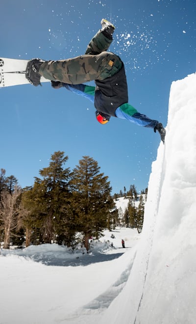 Craig McMorris One Foot Frontside Inverts a quarter pipe at Red Bull Snow Team Sessions at Mammoth Mt. in Mammoth Lakes, CA May 13, 2023.