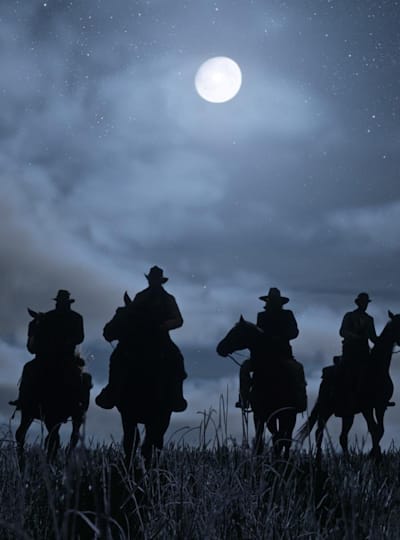 A promotional screenshot of the night-time in Red Dead Redemption 2.