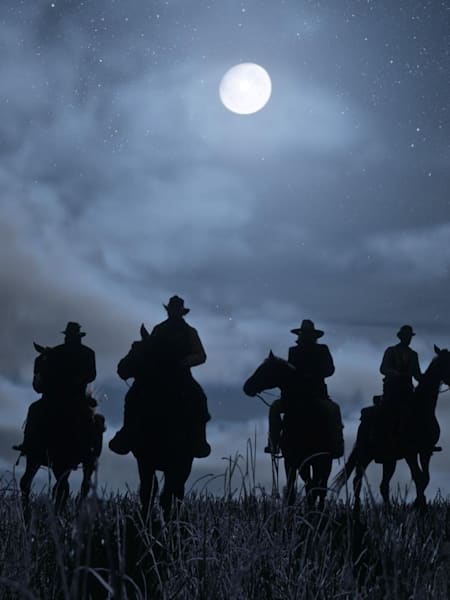 A promotional screenshot of the night-time in Red Dead Redemption 2.