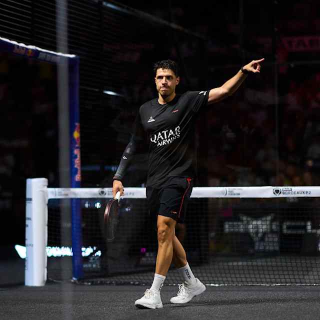 Agustin Tapia is captured in action on July 6, 2025 at the Bordeaux Premier Padel P2 finals in France, with Red Bull branding powering the energetic atmosphere