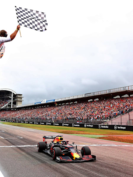 Race winner Max Verstappen of Aston Martin Red Bull Racing takes the chequered flag and the win during the F1 Grand Prix of Germany at Hockenheimring on July 28, 2019 in Hockenheim, Germany.