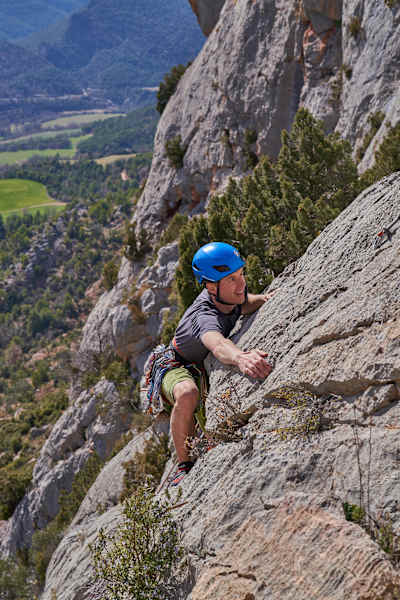 Climbing up rock face in Catalunya, Spain.