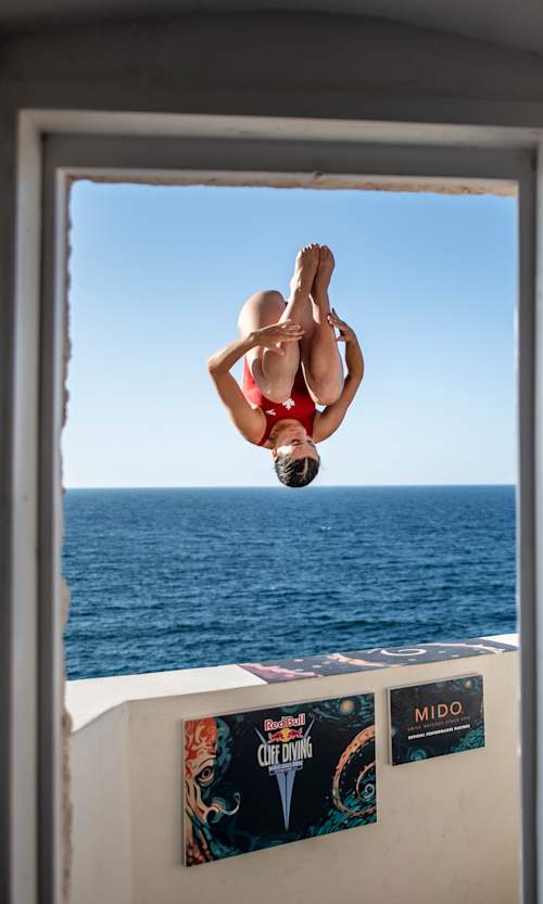 In 2024, Simone Leathead plunges from 20m from the famous baclony during the opening round of the Red Bul; Cliff Diving World Series event in Polignano a Mare, Italy