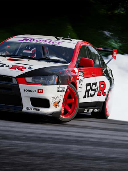 Screenshot aus GRID Legends zeigt einen Mitsubishi Lancer beim Driften. In unserem Drift-Guide liefern wir euch Tipps und Tricks.