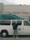 A van is parked outside the offices of The City Surf Project in San Francisco, California, USA.
