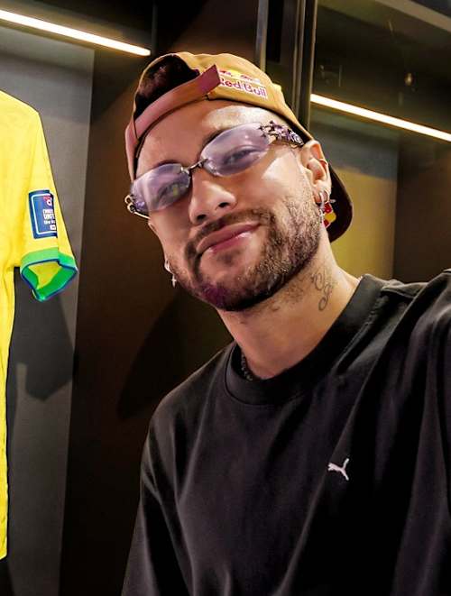 Neymar Jr. stands in front of his number 10 Brazil football jersey during filming of his show Neymar Jr. Full Access