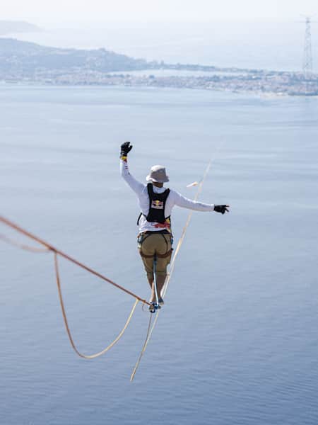 Jaan Roose attempts to cross the Strait of Messina between Italy and Sicily via slackline on July 10, 2024.