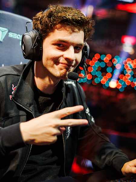 G2 Esports League of Legends pro Mihael 'Mikyx' Mehle gives a V sign to camera.