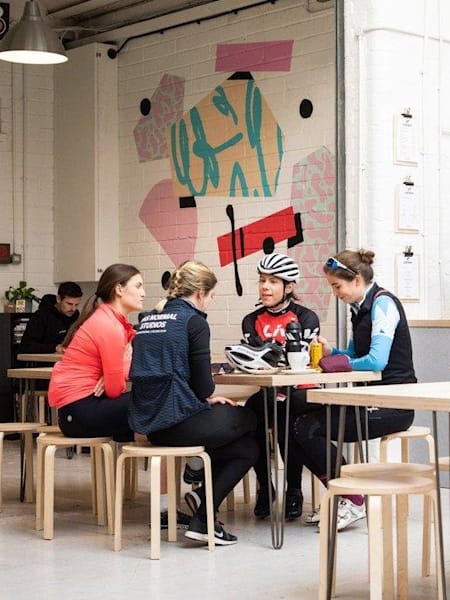Cyclists in the Camber Cafe in Business As Usual, Bristol